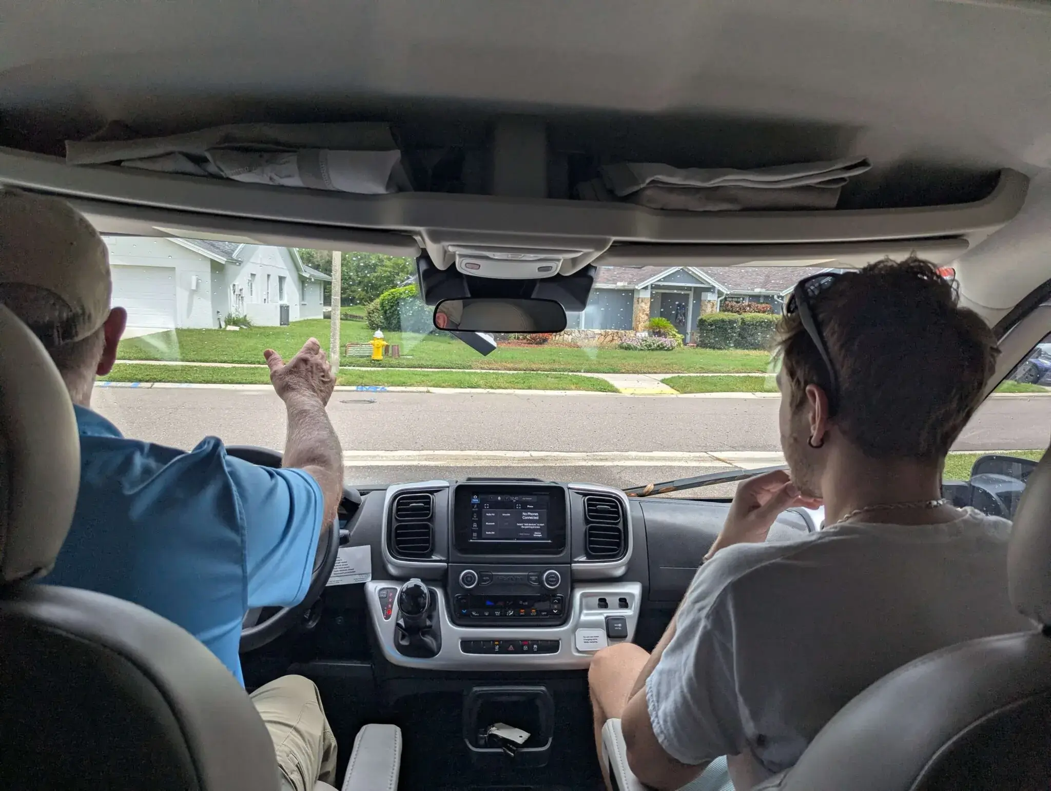 Small motorhome driver cab with steering wheel and dashboard